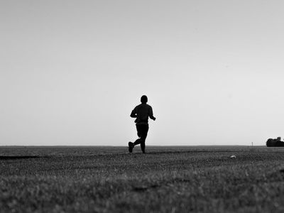 Blurred silhouette of a person in a dynamic cardio pose
